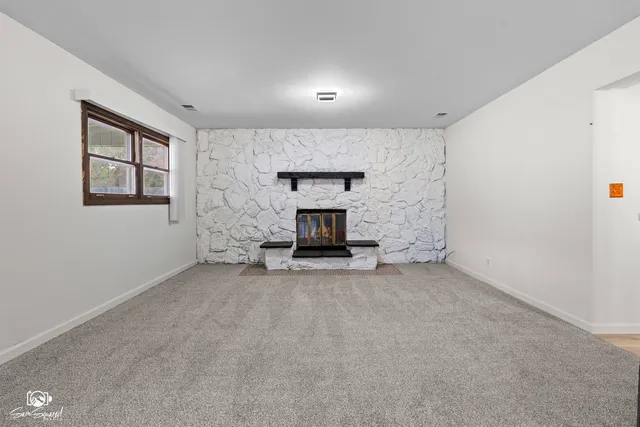 a view of a livingroom with a fireplace