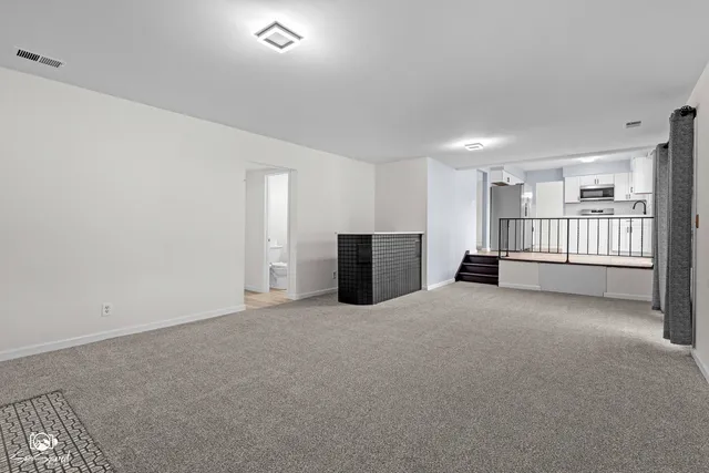 a view of a livingroom with a staircase