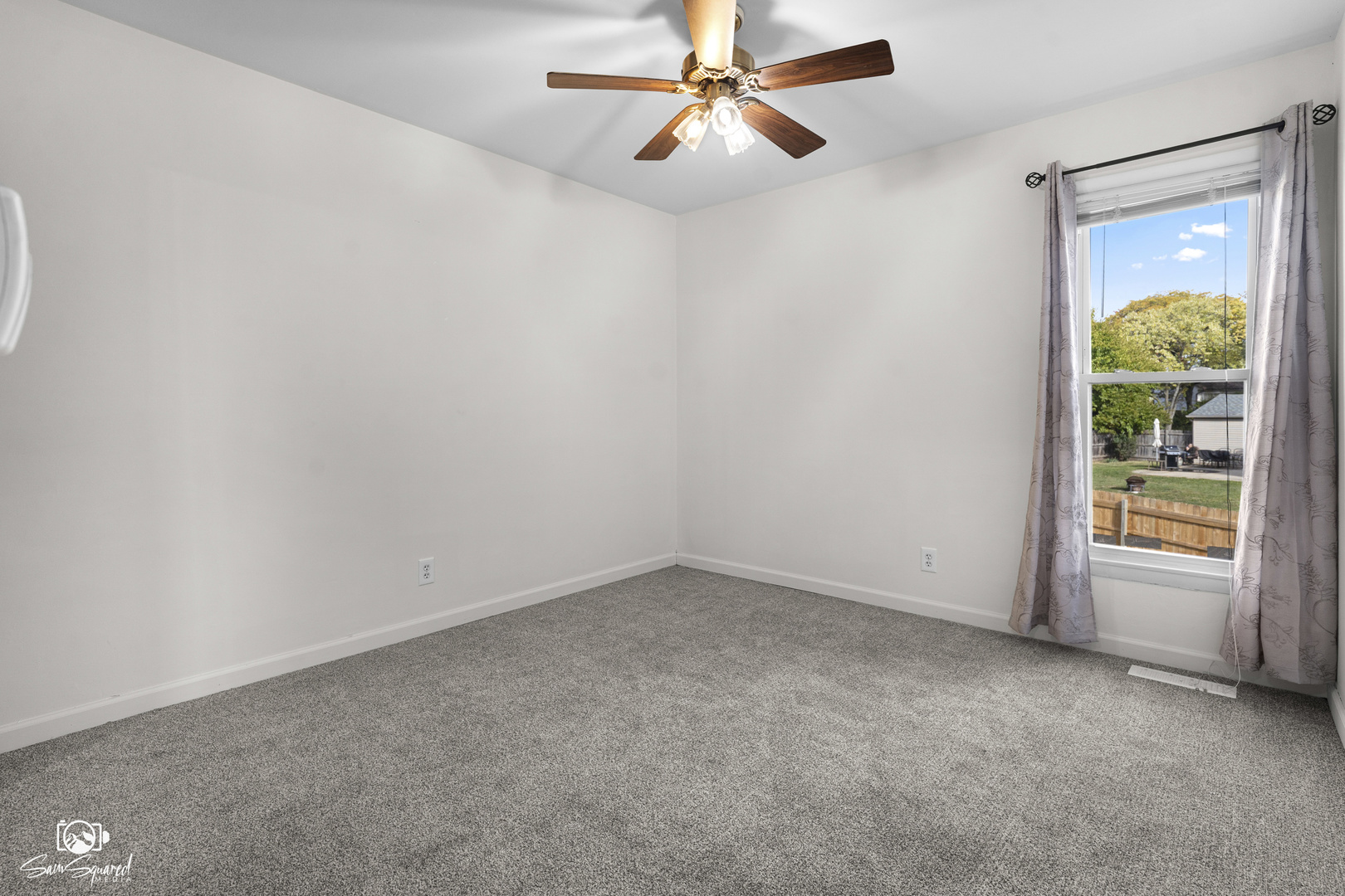 118 Camelot Way Bolingbrook, IL 60440 - Photo 17 of 32 an empty room with a window and a fan