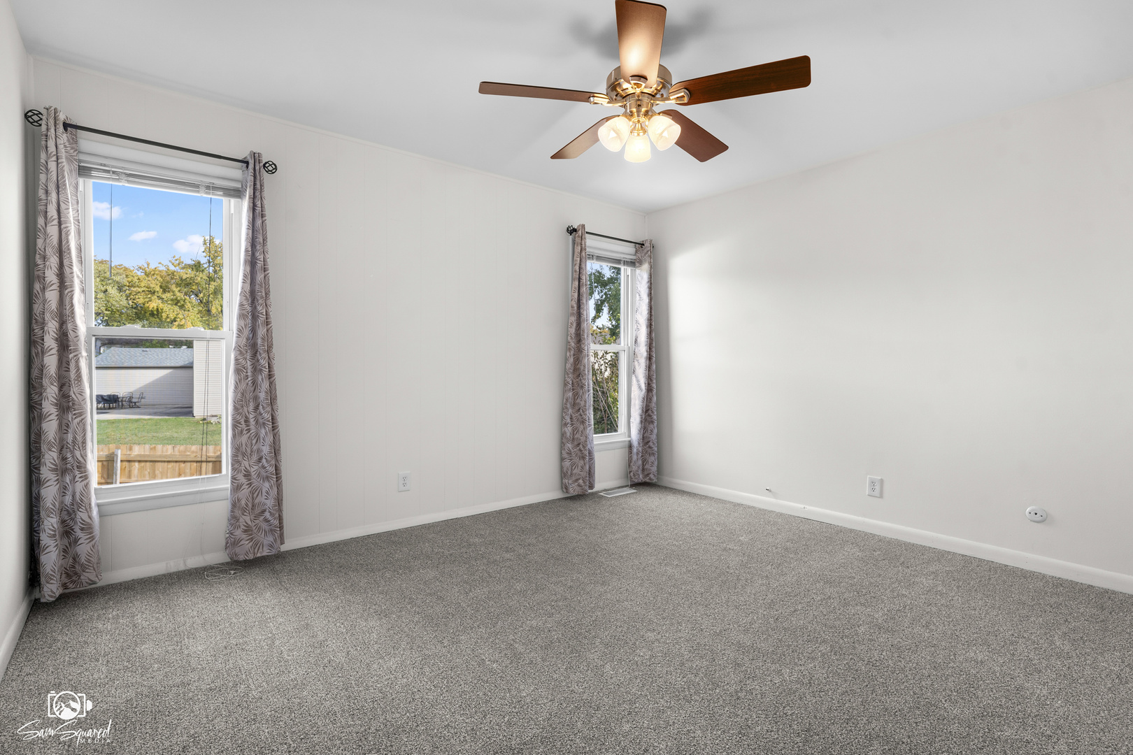 118 Camelot Way Bolingbrook, IL 60440 - Photo 19 of 32 an empty room with windows and fan