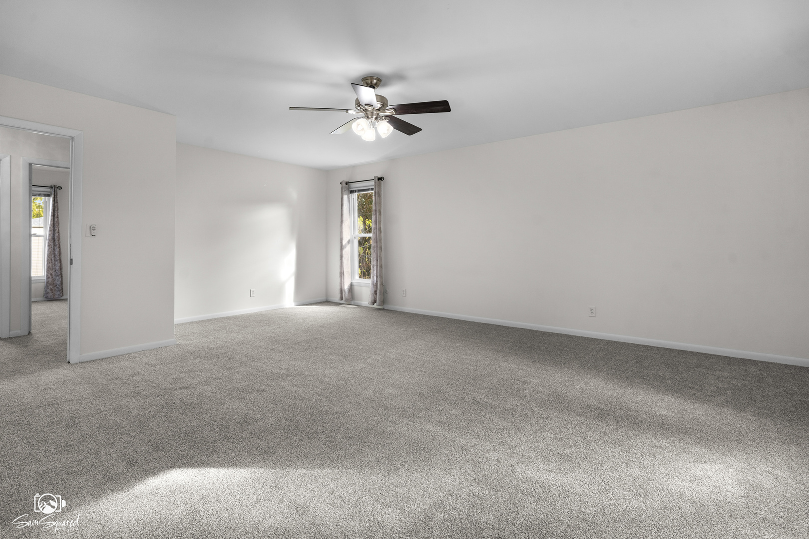 118 Camelot Way Bolingbrook, IL 60440 - Photo 21 of 32 a view of a livingroom with a ceiling fan and window