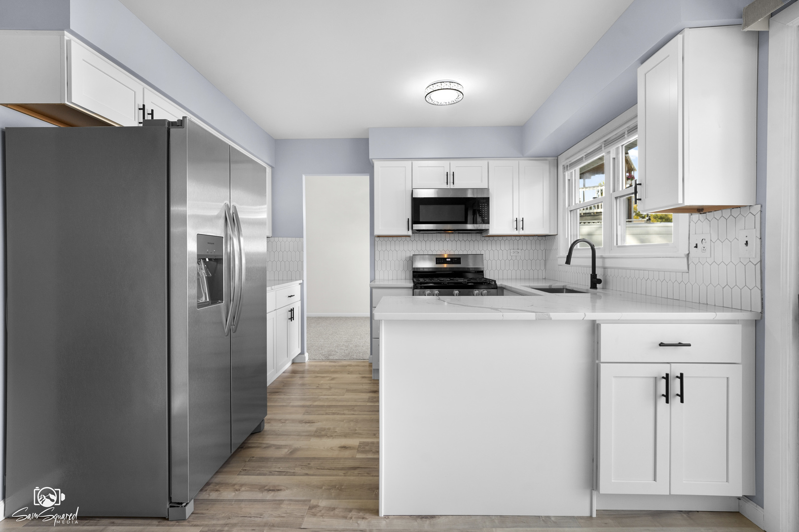 118 Camelot Way Bolingbrook, IL 60440 - Photo 4 of 32 a kitchen with stainless steel appliances a refrigerator stove and sink