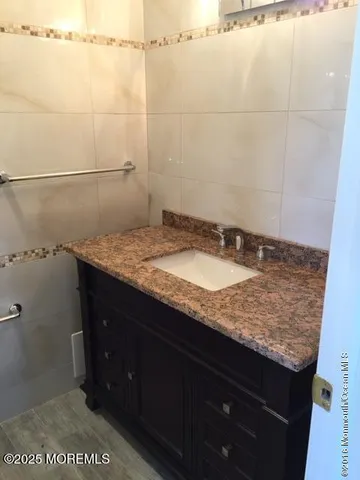 a living room with furniture window and a flat screen tv