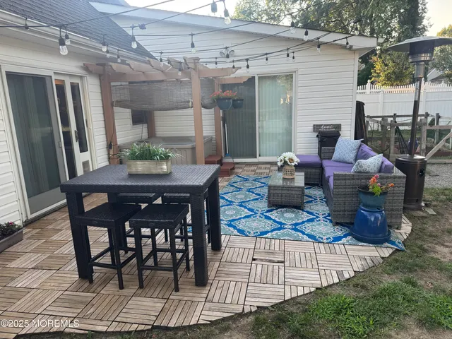 a dining room with a wooden table and chairs