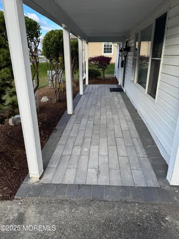 a view of an entryway with wooden floor
