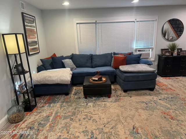 a kitchen with stainless steel appliances granite countertop a refrigerator a stove and a sink with wooden cabinets