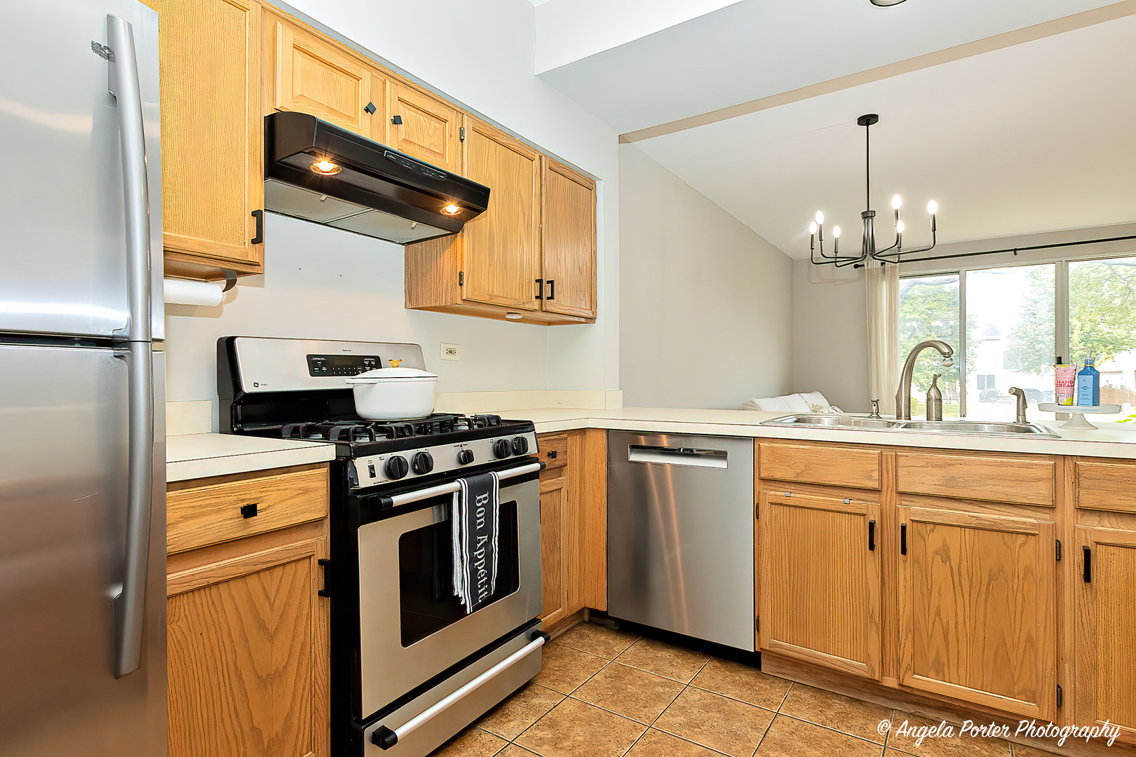 17838 Braewick Road, Unit 16017 Gurnee, IL 60031 - Photo 11 of 28 a kitchen with a stove and a sink