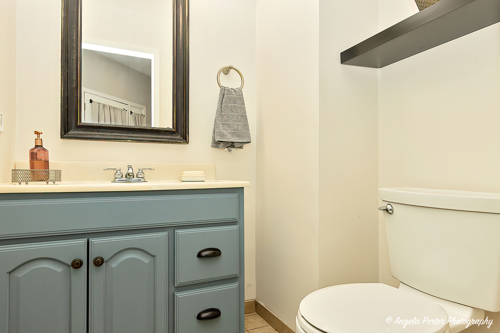 17838 Braewick Road, Unit 16017 Gurnee, IL 60031 - Photo 15 of 28 a bathroom with a sink vanity mirror and toilet