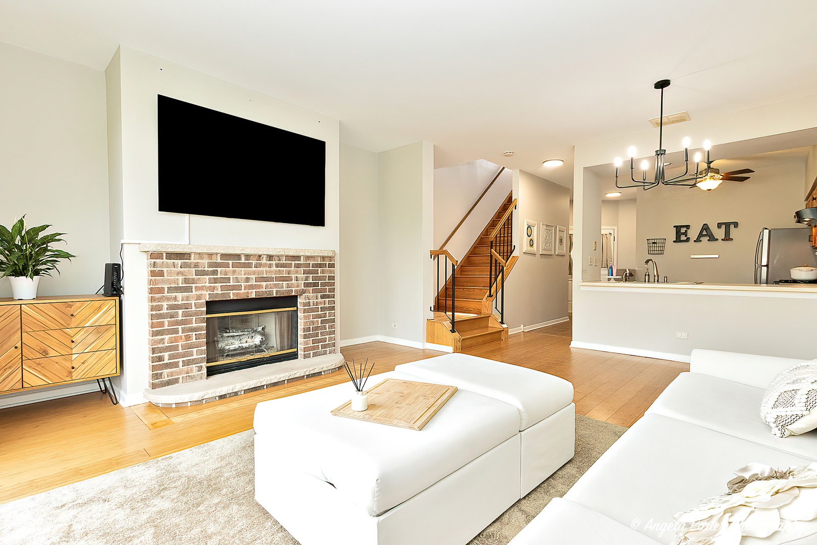 17838 Braewick Road, Unit 16017 Gurnee, IL 60031 - Photo 6 of 28 a living room with furniture fireplace and flat screen tv