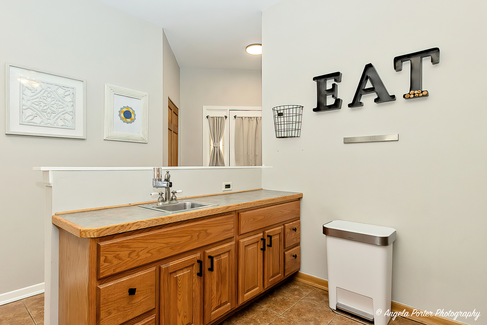 17838 Braewick Road, Unit 16017 Gurnee, IL 60031 - Photo 9 of 28 a bathroom with a sink and a mirror