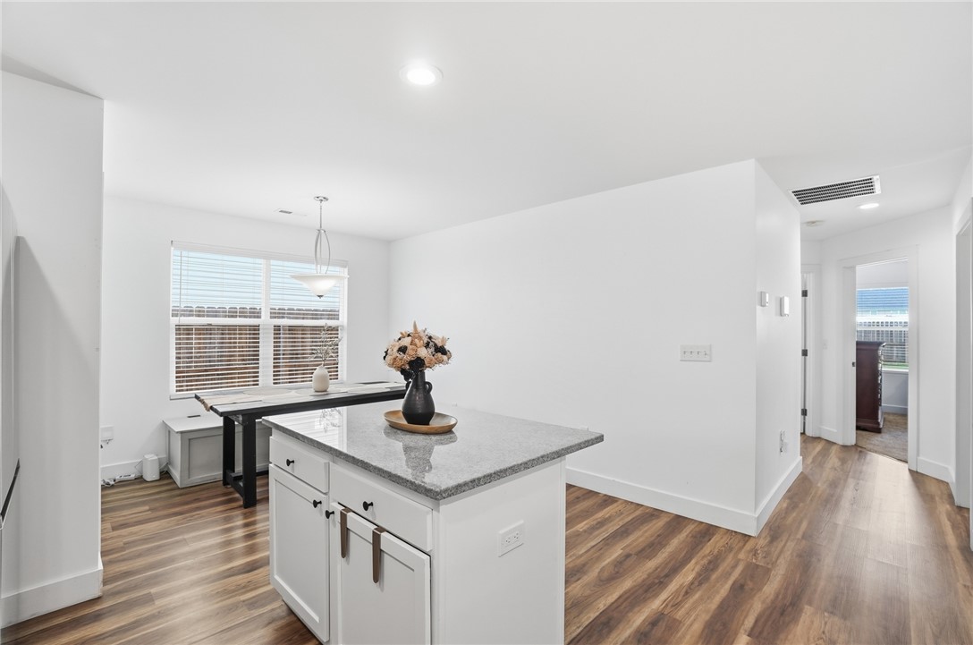 728 East Northern Avenue Springfield, OH 45503 - Photo 12 of 35 This bright kitchen offers a practical island with ample counter space and convenient window views.