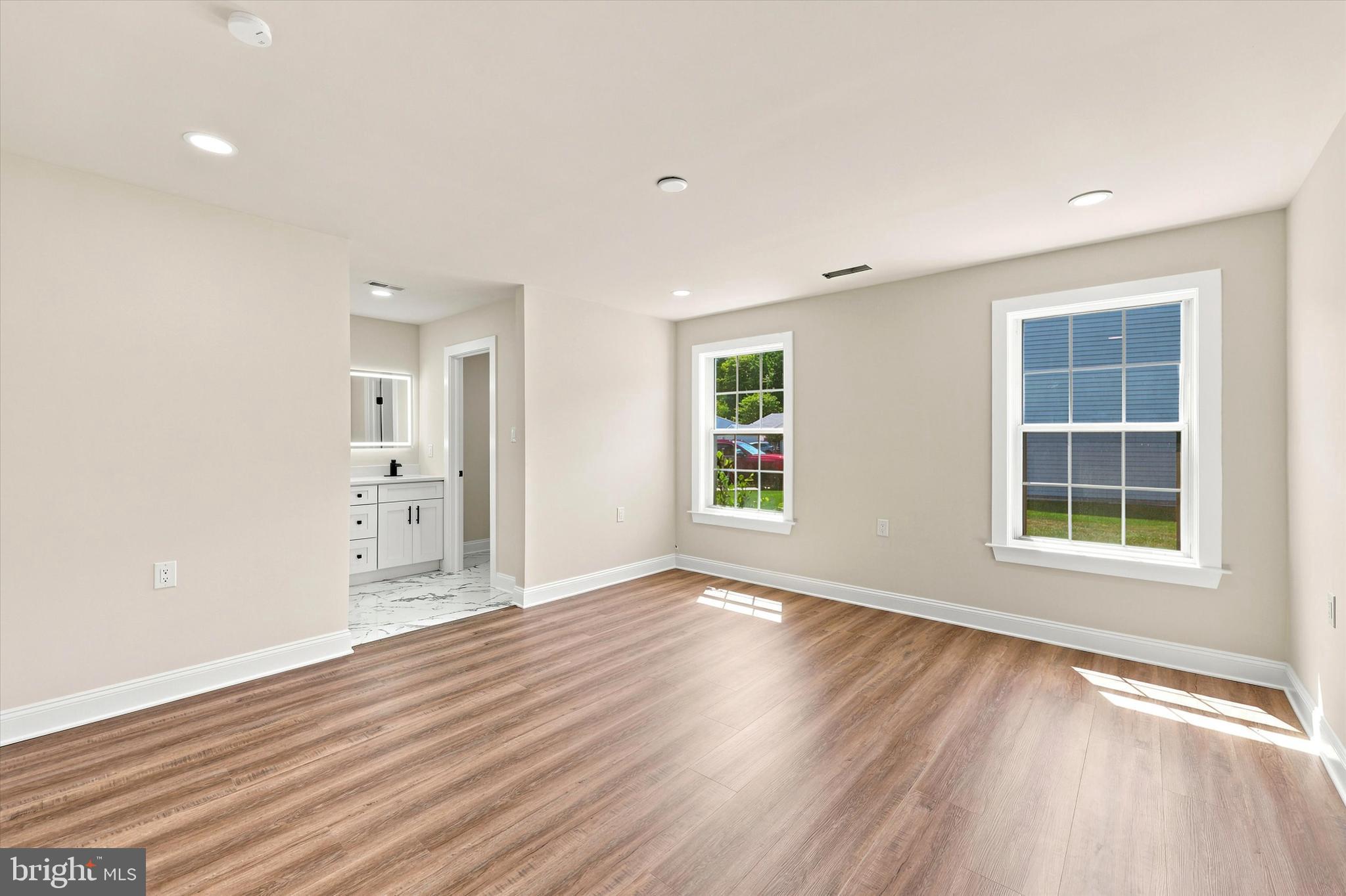 2 Emory Lane Mount Laurel, NJ 08054 - Photo 11 of 25 an empty room with wooden floor and windows