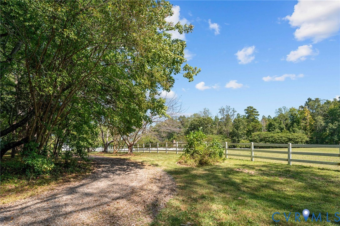 1801 Georgetown Road Heathsville, VA 22473 - Photo 14 of 83 Expansive green space with mature trees, a gravel