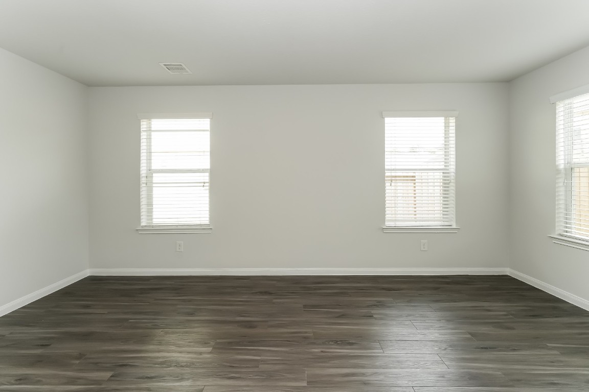 2410 High Island Way Houston, TX 77073 - Photo 11 of 17 an empty room with wooden floor and windows
