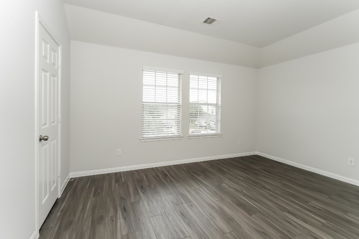 2410 High Island Way Houston, TX 77073 - Photo 12 of 17 an empty room with wooden floor and windows