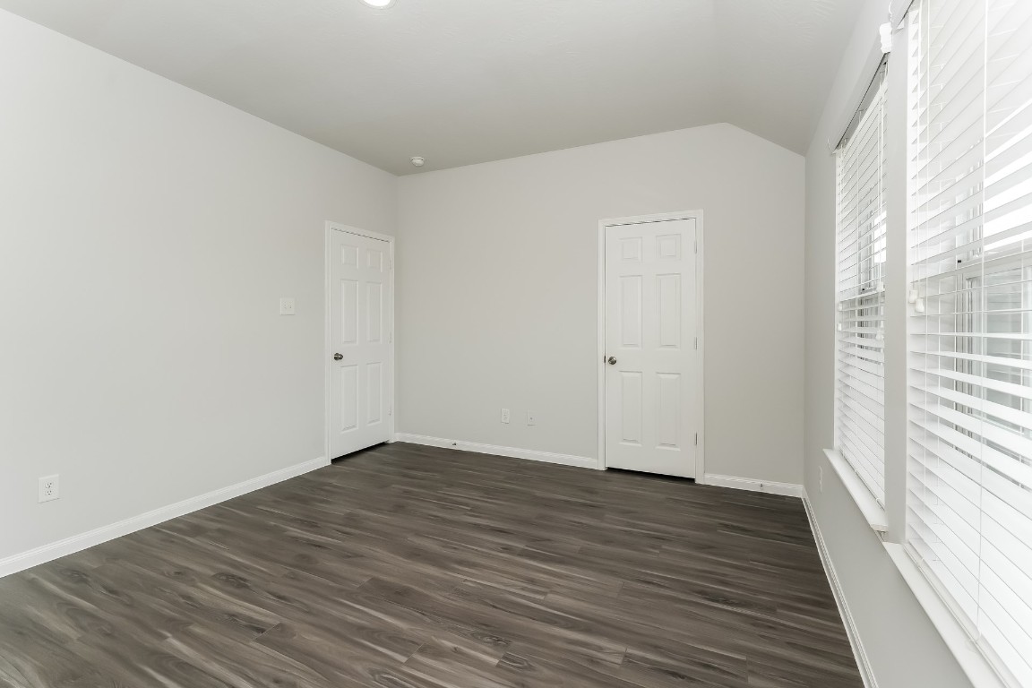 2410 High Island Way Houston, TX 77073 - Photo 13 of 17 a view of an empty room with wooden floor and a window