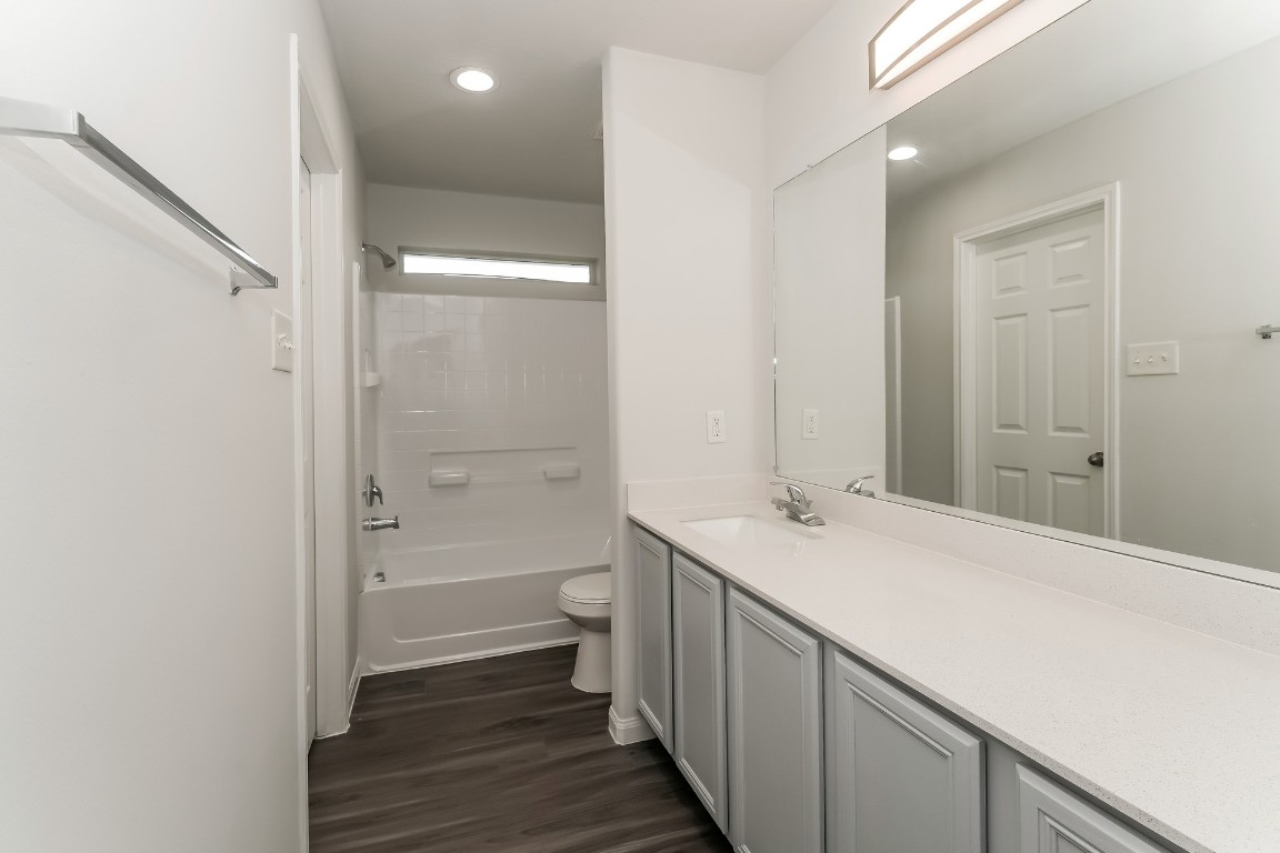 2410 High Island Way Houston, TX 77073 - Photo 14 of 17 a bathroom with a sink a toilet and shower