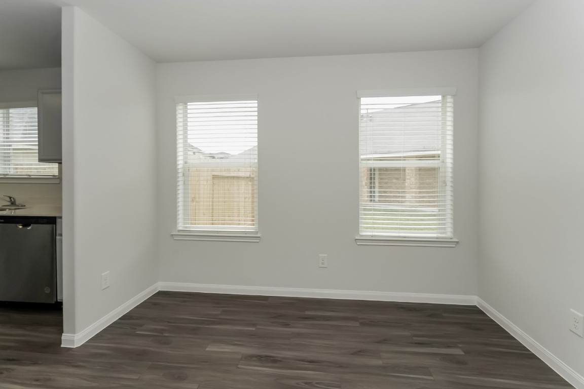 2410 High Island Way Houston, TX 77073 - Photo 6 of 17 a view of an empty room with wooden floor and a window
