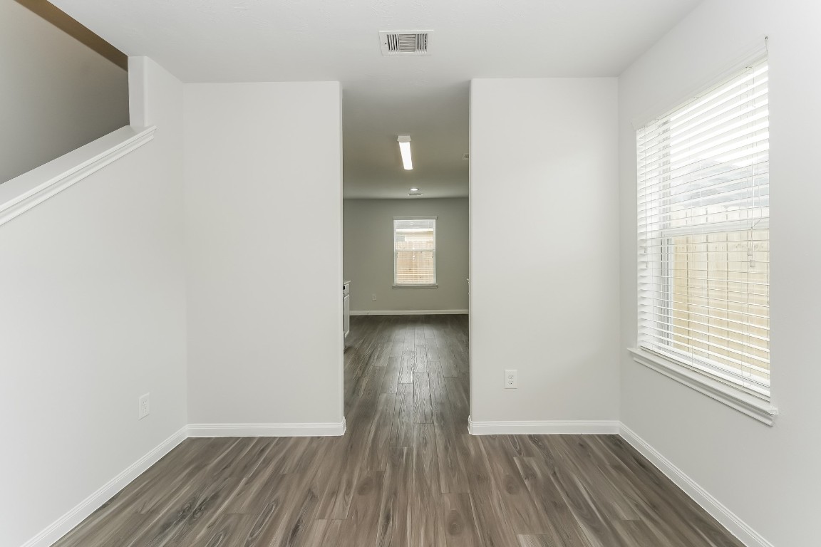 2410 High Island Way Houston, TX 77073 - Photo 10 of 17 a view of empty room with window and wooden floor
