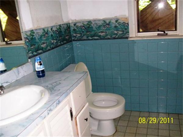 35 Lower Lake Road Ashburnham, MA 01430 - Photo 5 of 7 a bathroom with a granite countertop sink a toilet and a mirror