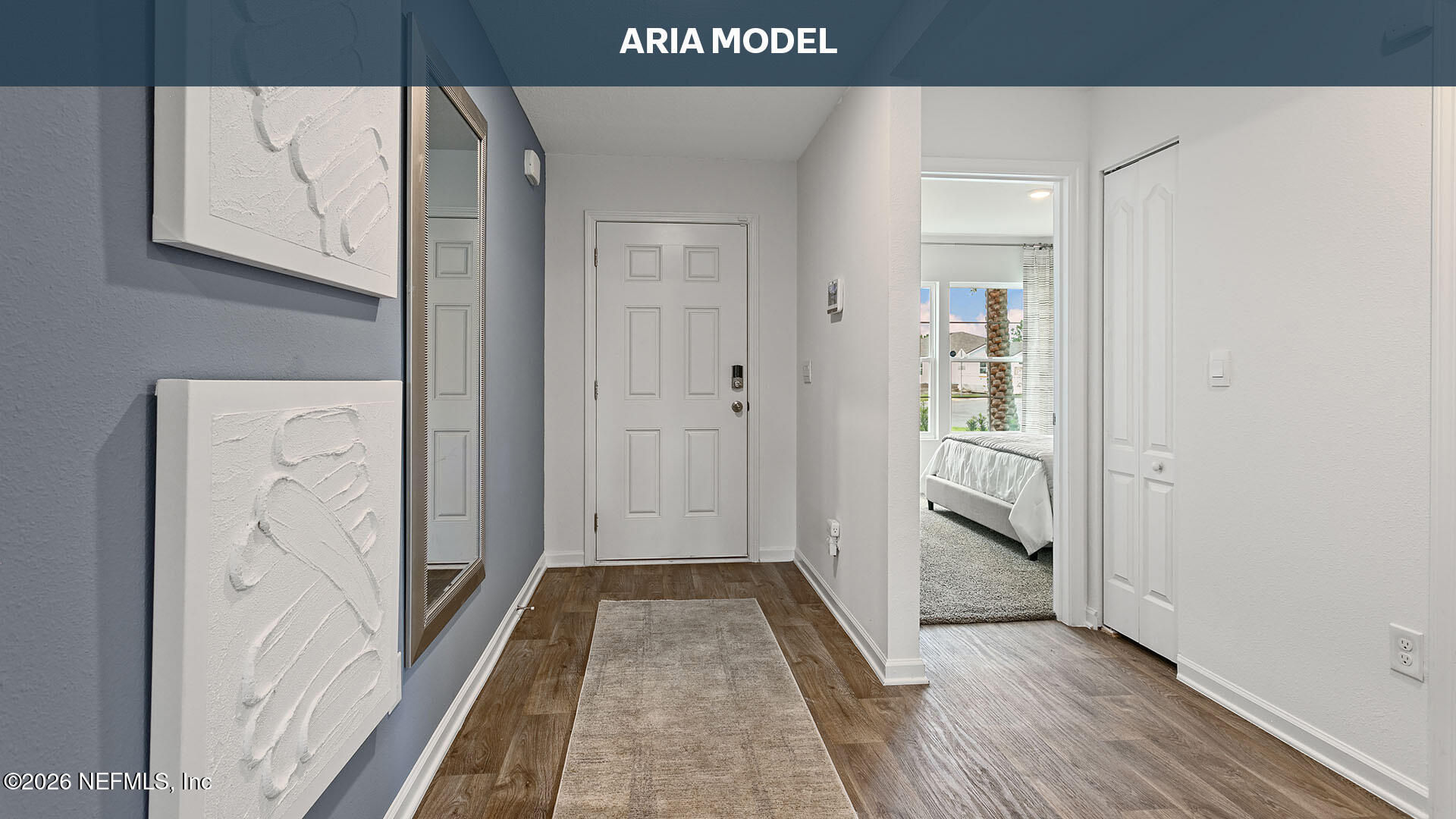12268 Yew Tree Road Jacksonville, FL 32218 - Photo 4 of 48 a view of a hallway with wooden floor and entryway
