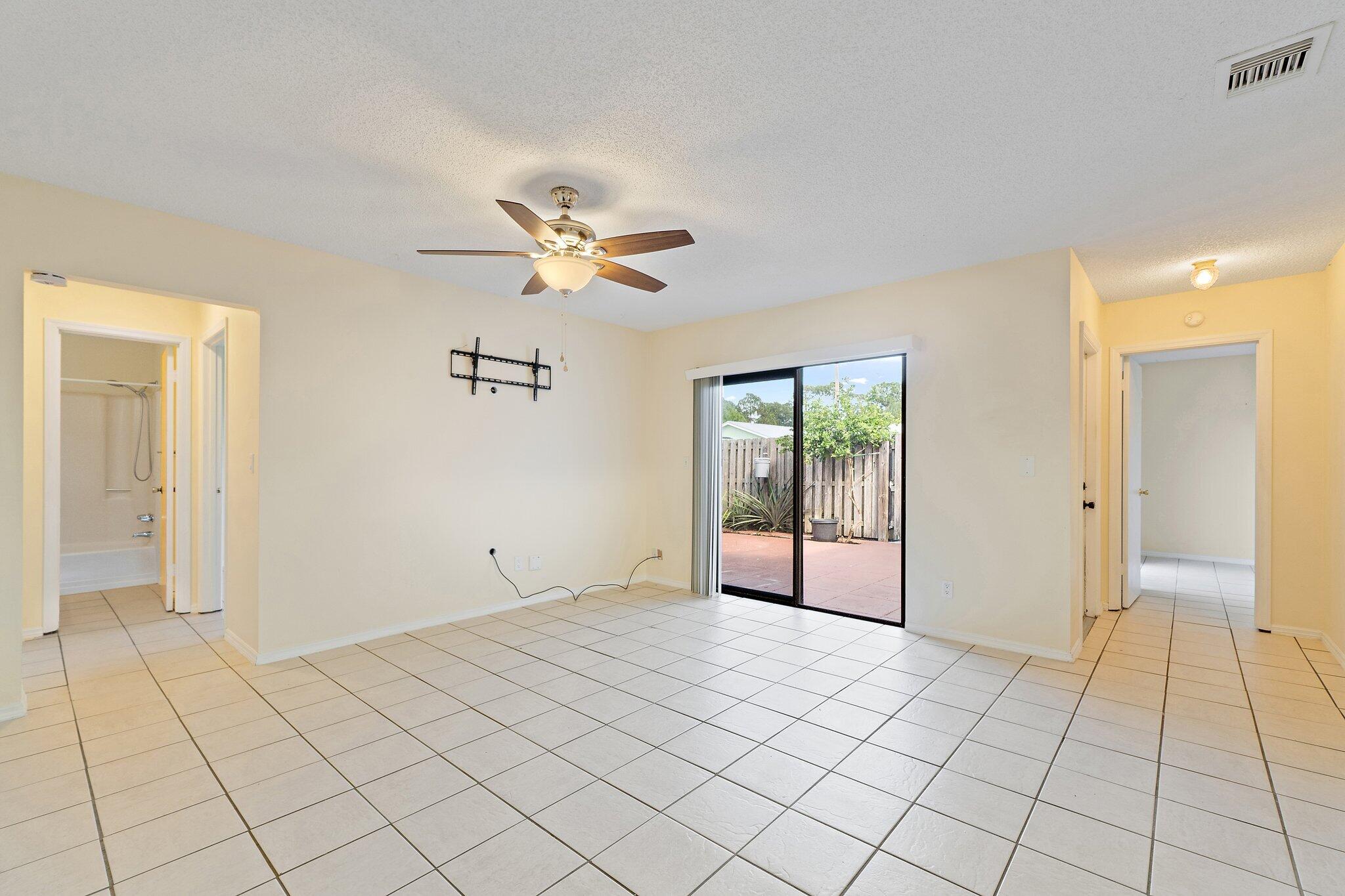 3581 Southeast Cobia Way Stuart, FL 34997 - Photo 15 of 26 a view of an empty room and window