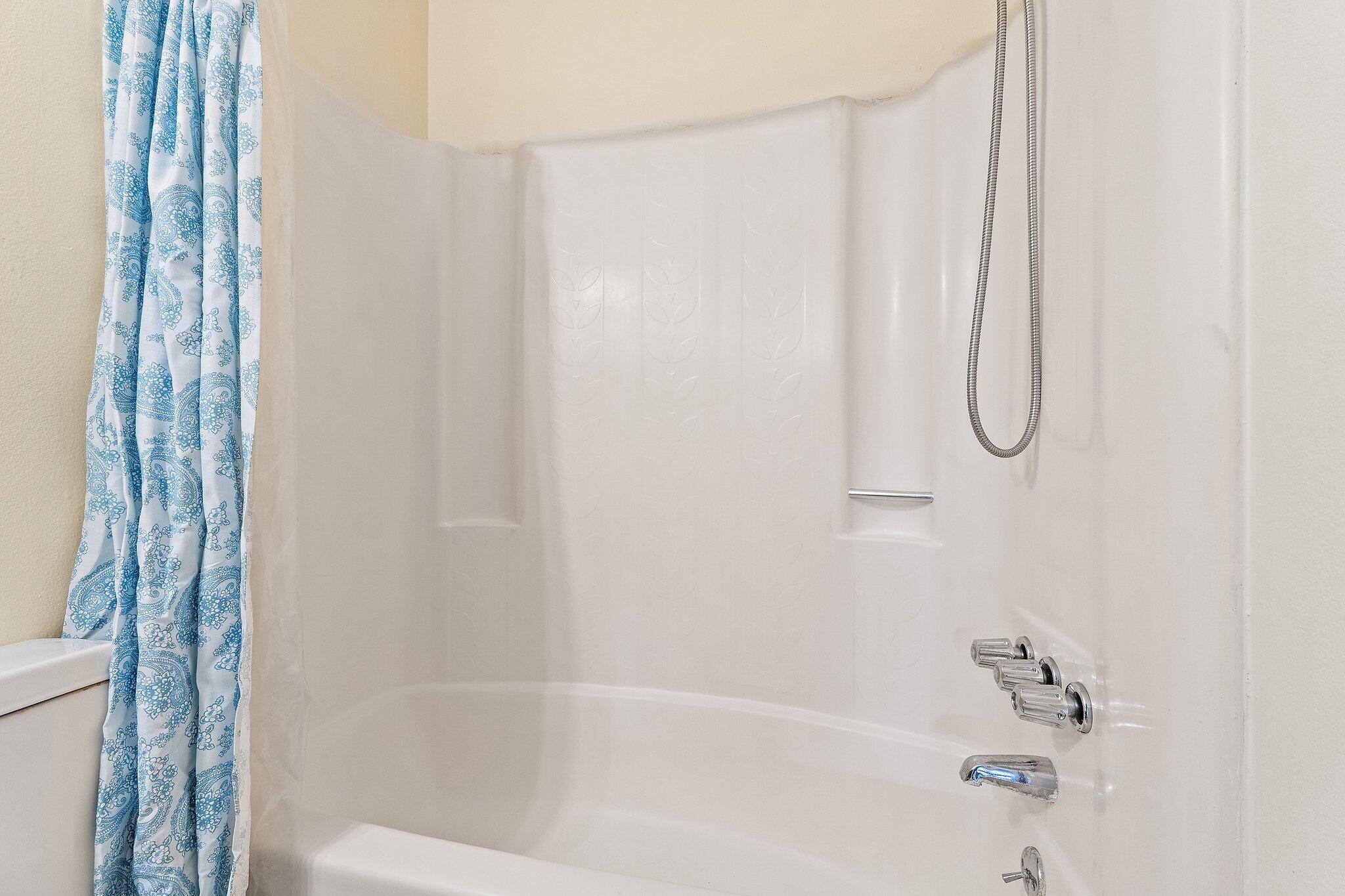 3581 Southeast Cobia Way Stuart, FL 34997 - Photo 25 of 26 a bathroom with a shower and a bath tub