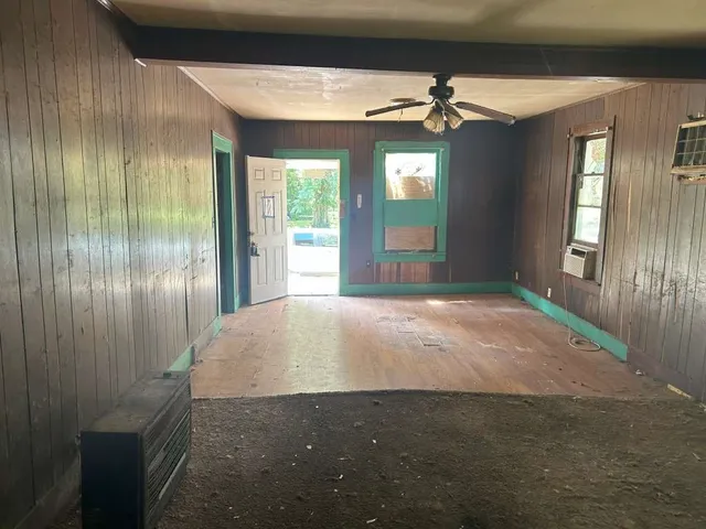 a view of an empty room with a fireplace