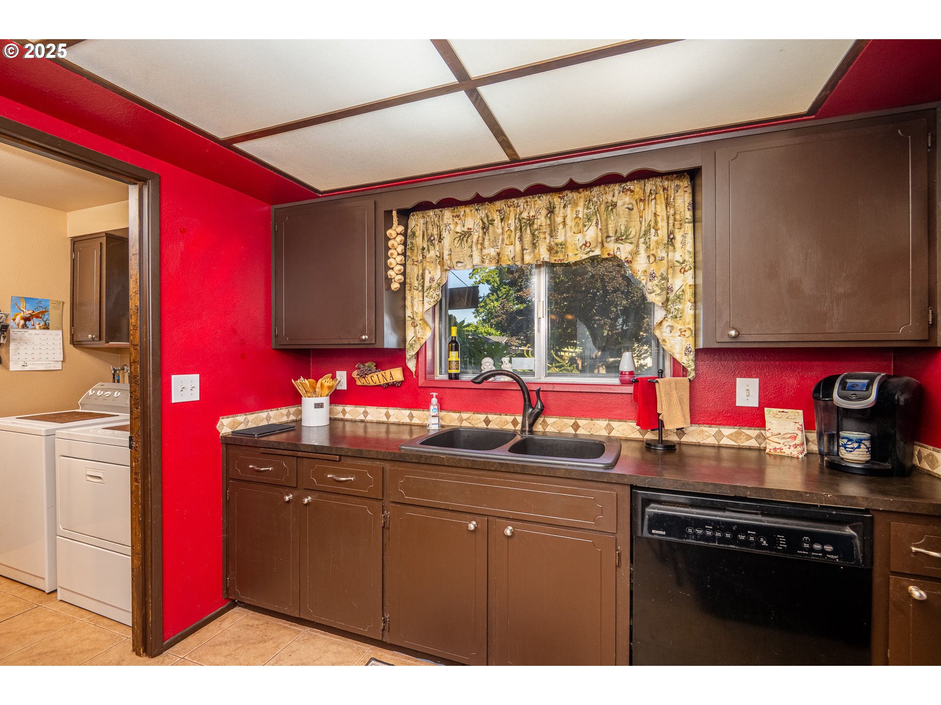 2121 Firth Avenue Springfield, OR 97477 - Photo 14 of 40 a kitchen with a sink cabinets and window
