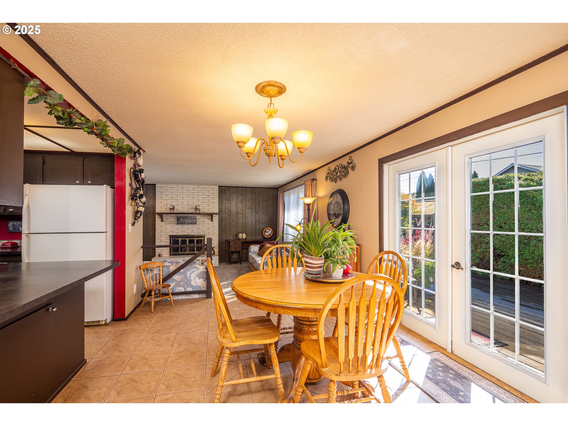 2121 Firth Avenue Springfield, OR 97477 - Photo 16 of 40 a view of a dining room with furniture and a chandelier