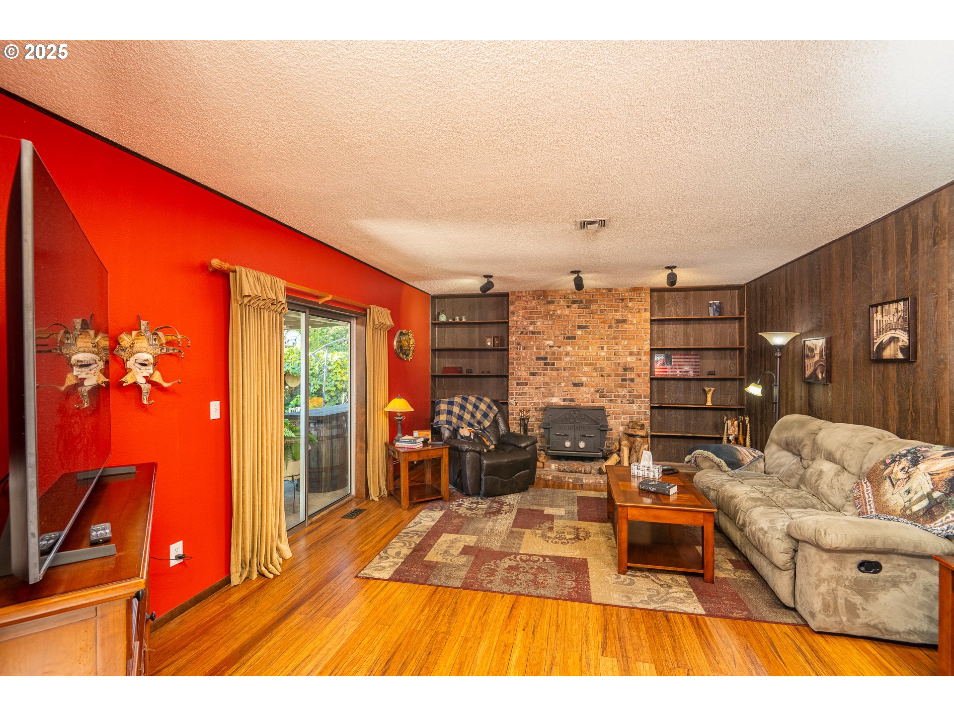 2121 Firth Avenue Springfield, OR 97477 - Photo 17 of 40 a living room with furniture a rug and a flat screen tv