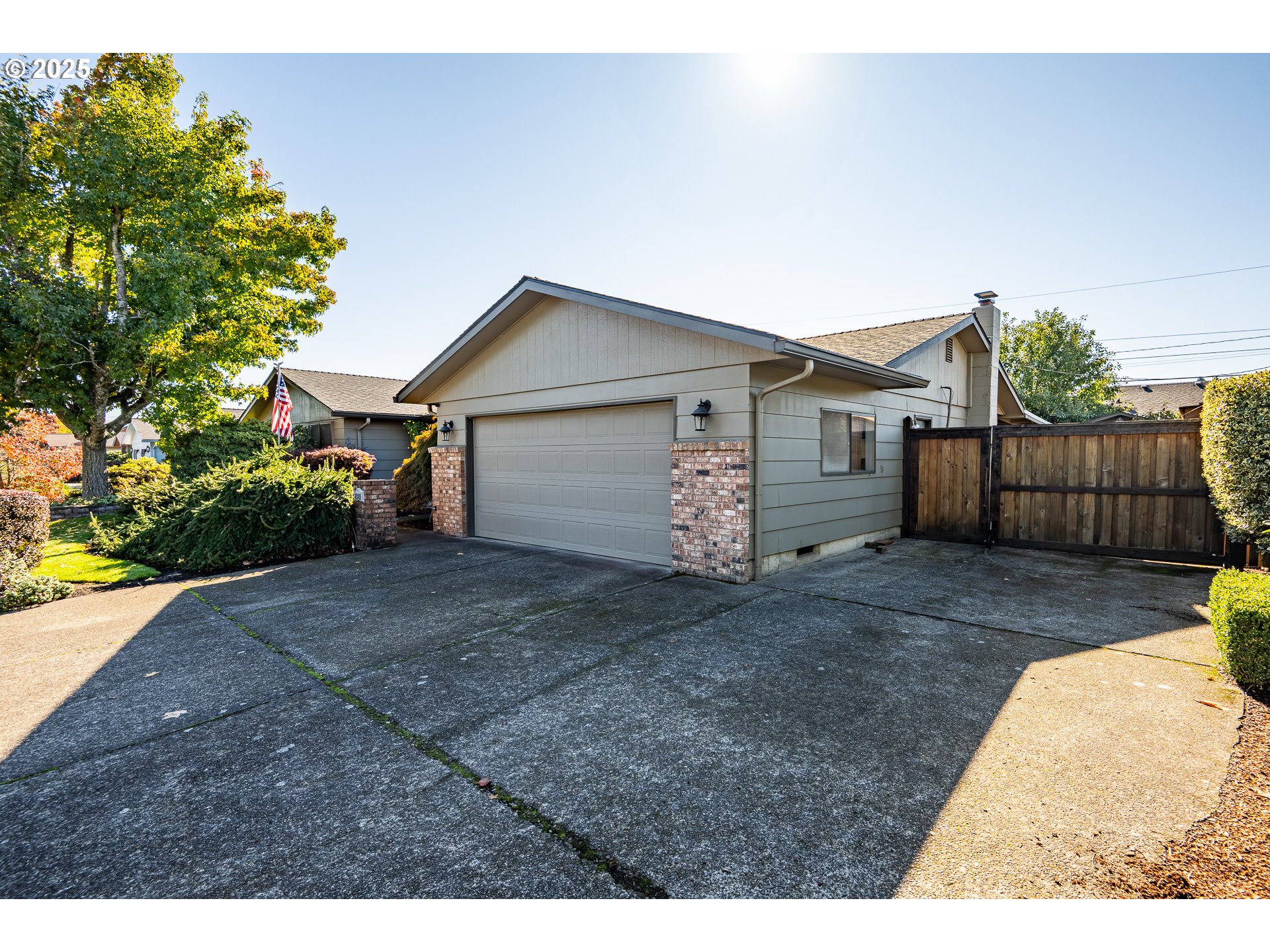 2121 Firth Avenue Springfield, OR 97477 - Photo 3 of 40 a view of a house with a yard and a garage