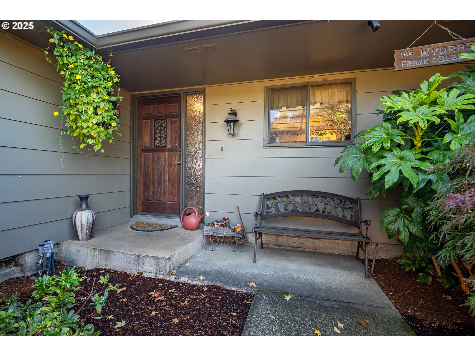 2121 Firth Avenue Springfield, OR 97477 - Photo 5 of 40 a view of a house with sitting area and potted plants