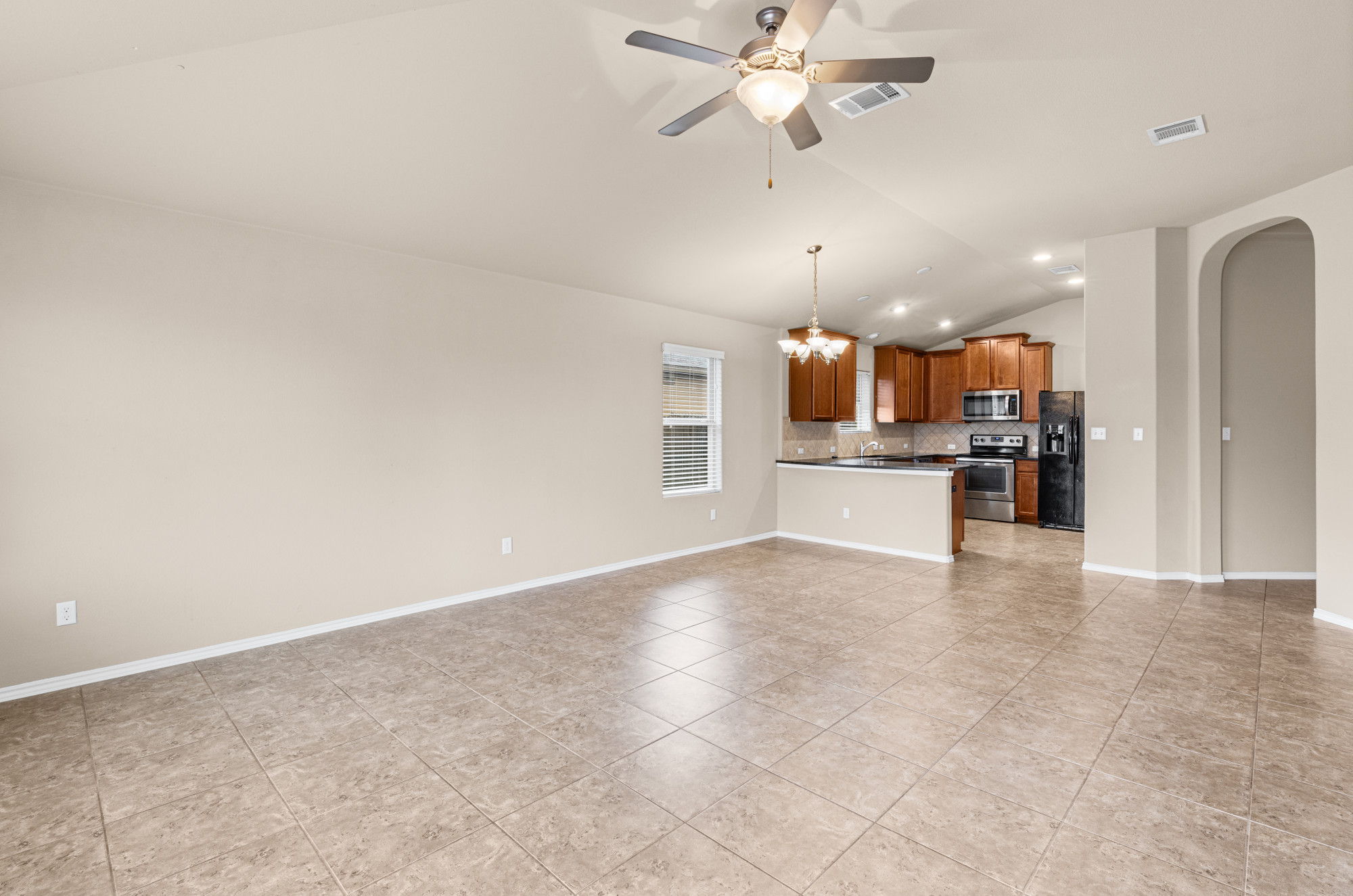 19308 Stokes Lane Pflugerville, TX 78660 - Photo 4 of 27 an empty room with cabinet and stainless steel appliances