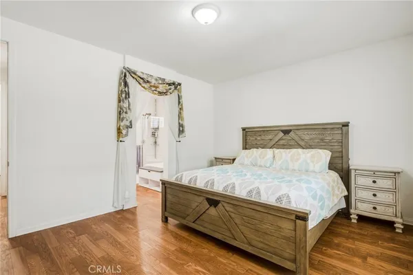a bedroom with a bed and a cabinets