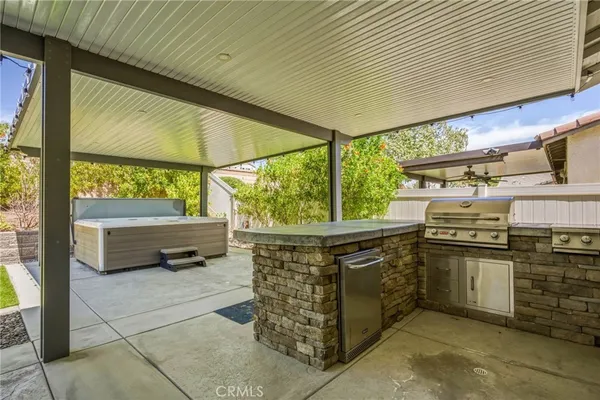 a backyard of a house with yard and outdoor seating