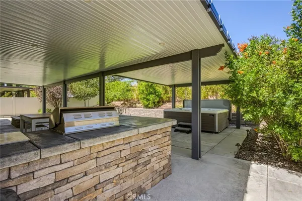 a view of a backyard with sitting area