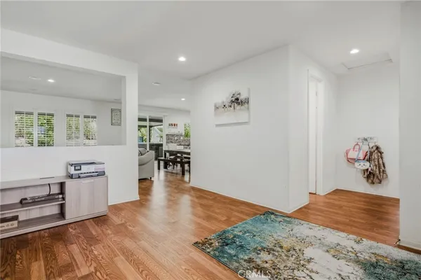 a bedroom with furniture and wooden floor