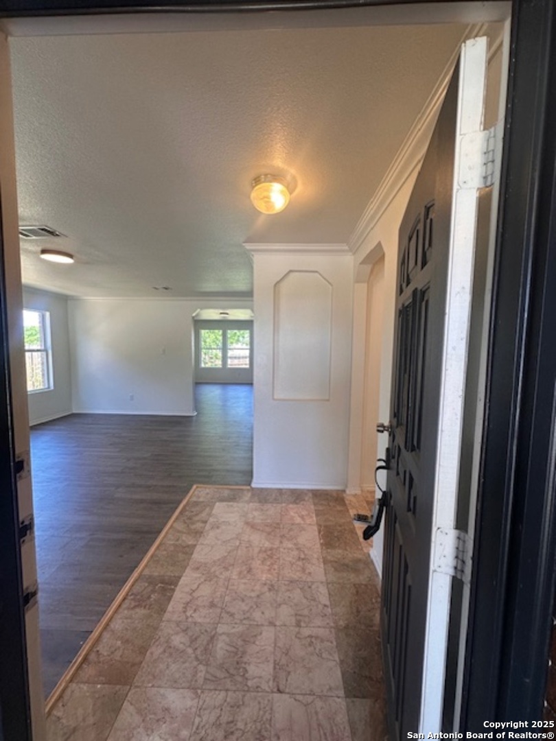 a view of hallway with livingroom