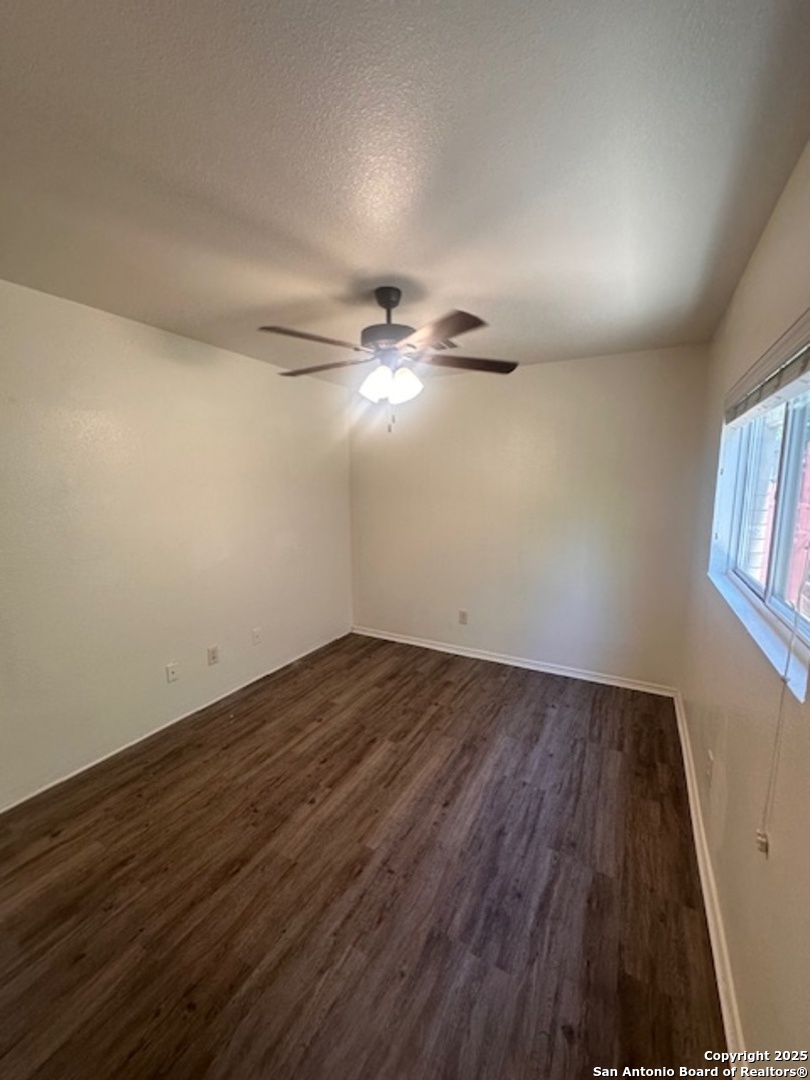 1667 Spice San Antonio, TX 78260 - Photo 11 of 25 wooden floor in an empty room with a window