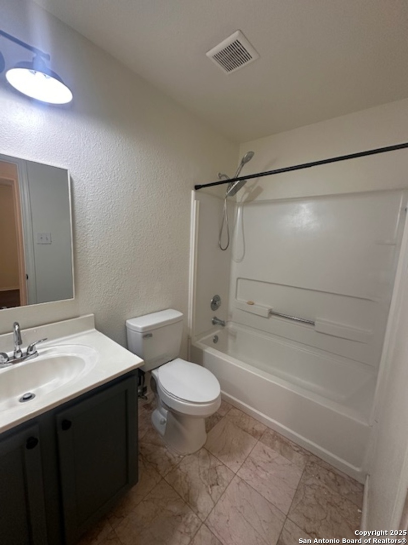 1667 Spice San Antonio, TX 78260 - Photo 12 of 25 a bathroom with a sink toilet and shower