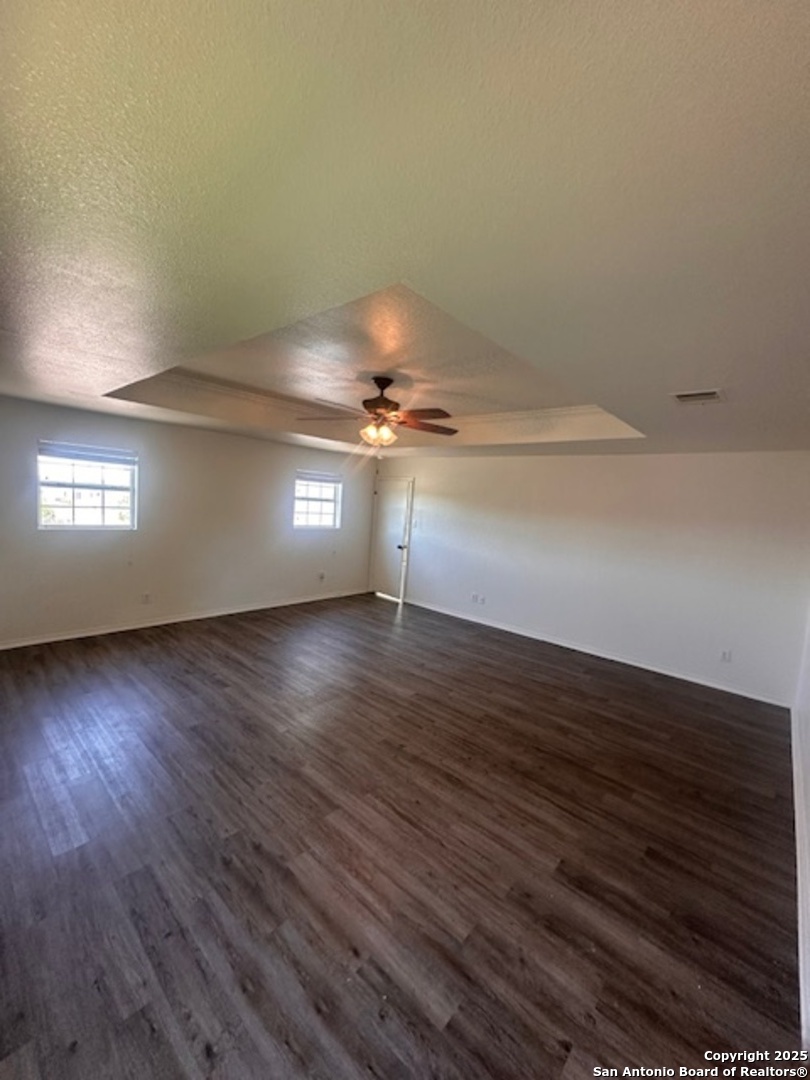1667 Spice San Antonio, TX 78260 - Photo 18 of 25 a view of empty room with wooden floor and fan
