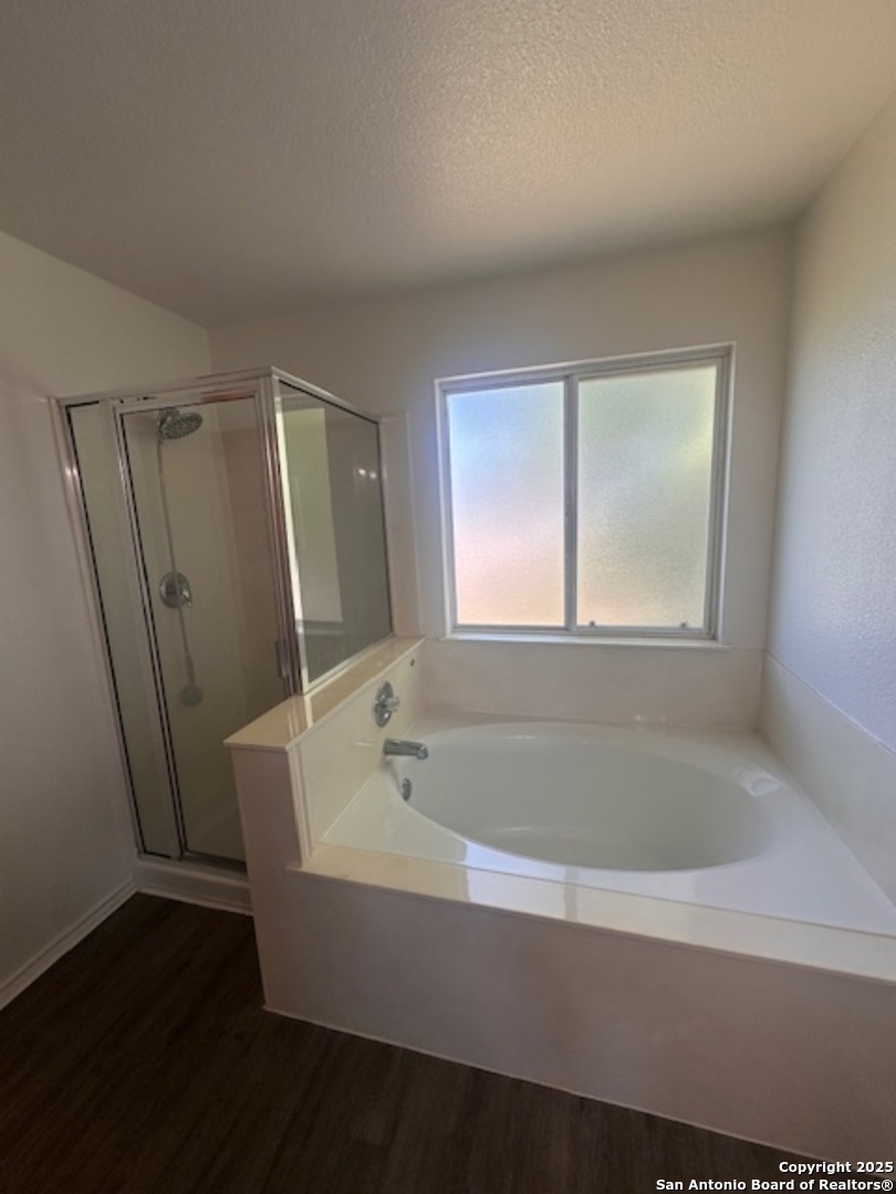 1667 Spice San Antonio, TX 78260 - Photo 19 of 25 a bathroom with a bathtub and shower
