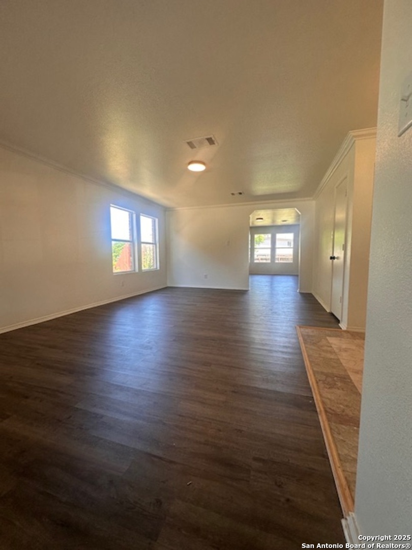 1667 Spice San Antonio, TX 78260 - Photo 2 of 25 an empty room with wooden floor and windows