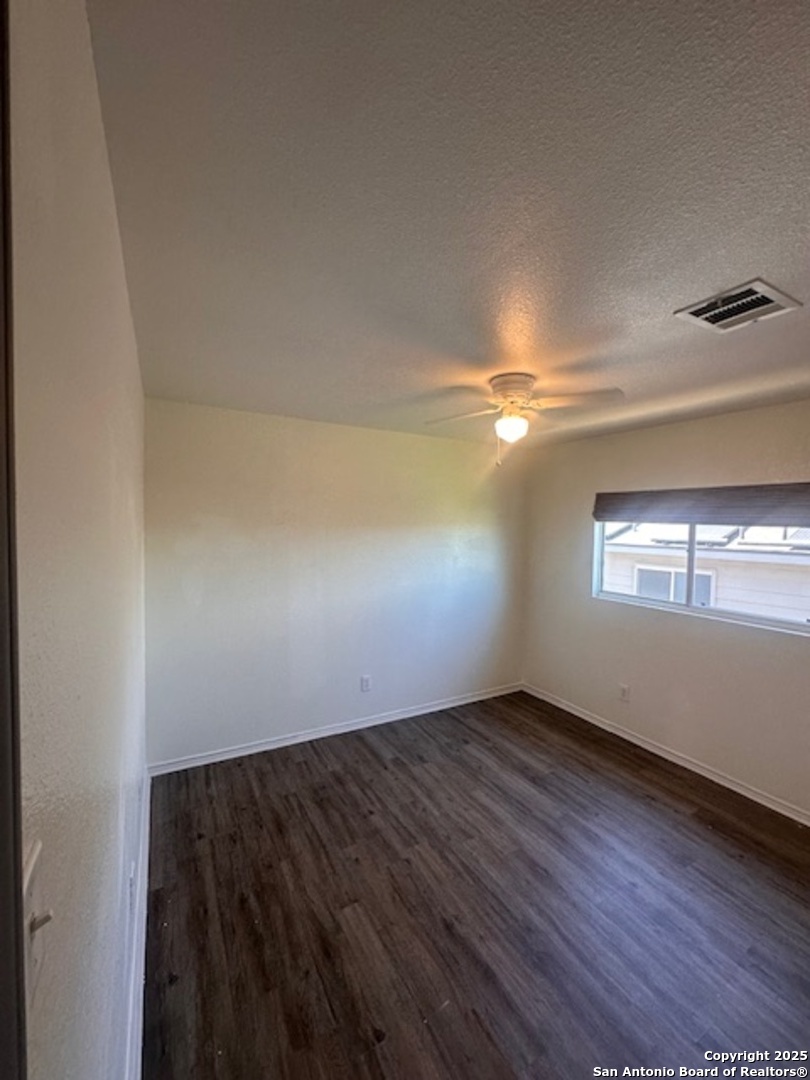 1667 Spice San Antonio, TX 78260 - Photo 22 of 25 an empty room with wooden floor and windows