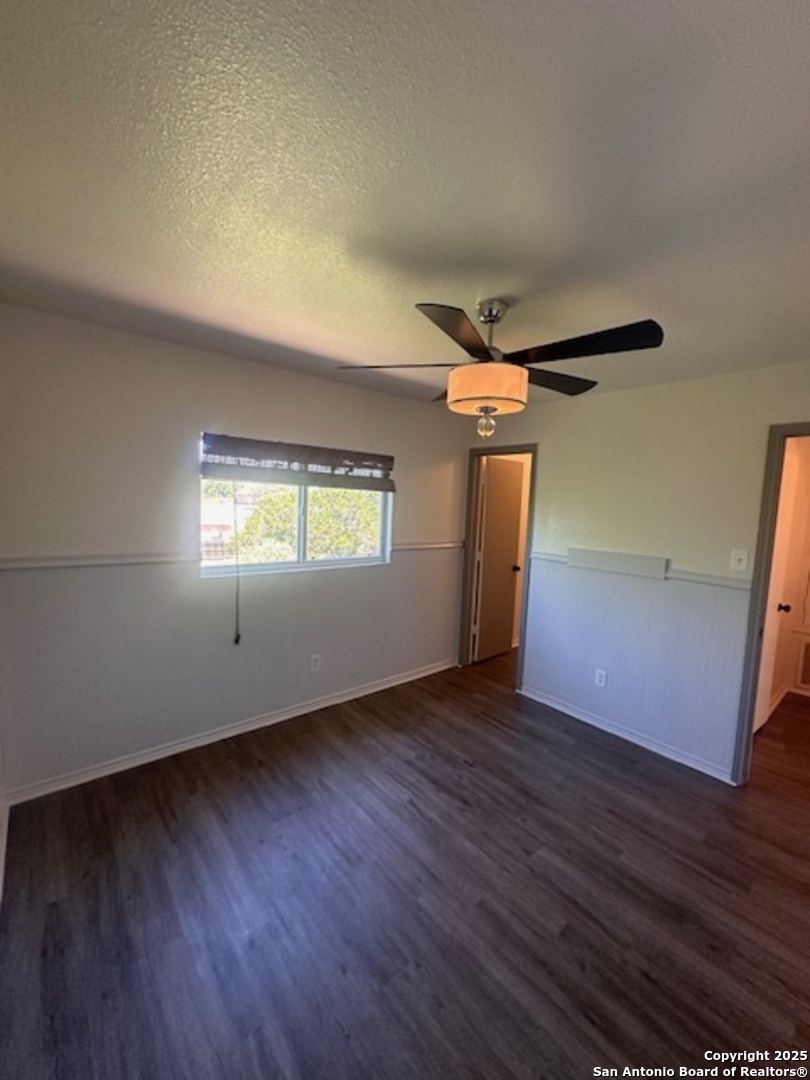 1667 Spice San Antonio, TX 78260 - Photo 24 of 25 a view of empty room with wooden floor and fan