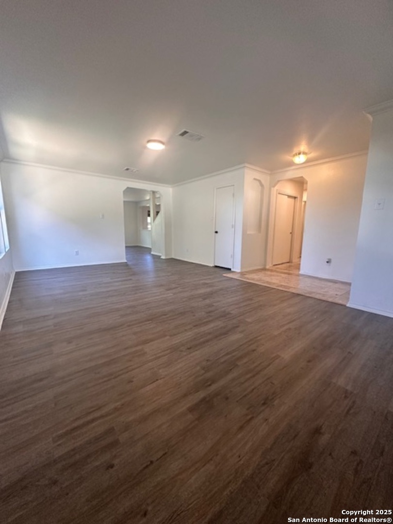 1667 Spice San Antonio, TX 78260 - Photo 3 of 25 an empty room with wooden floor and windows