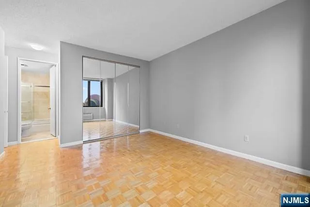a bathroom with a sink toilet and a mirror