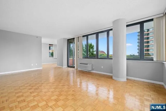 a view of an empty room with a window