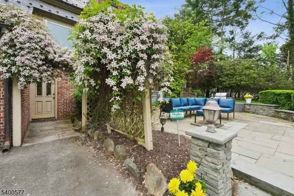 a spacious bathroom with double vanity a mirror a window and a shower